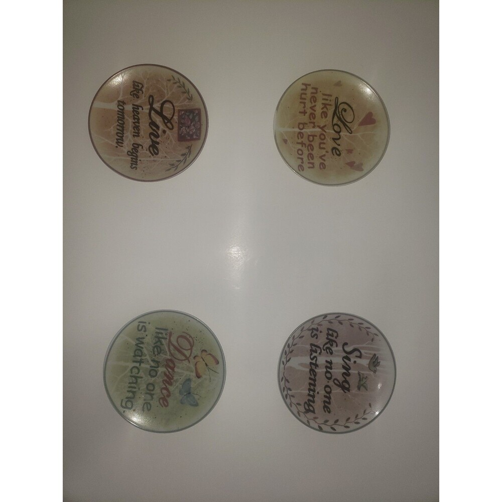 Set of four 4.5" plates with inspirational quotes. Features designs in tan,